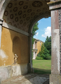 Apollo's Triumphal Arch with manor house in background